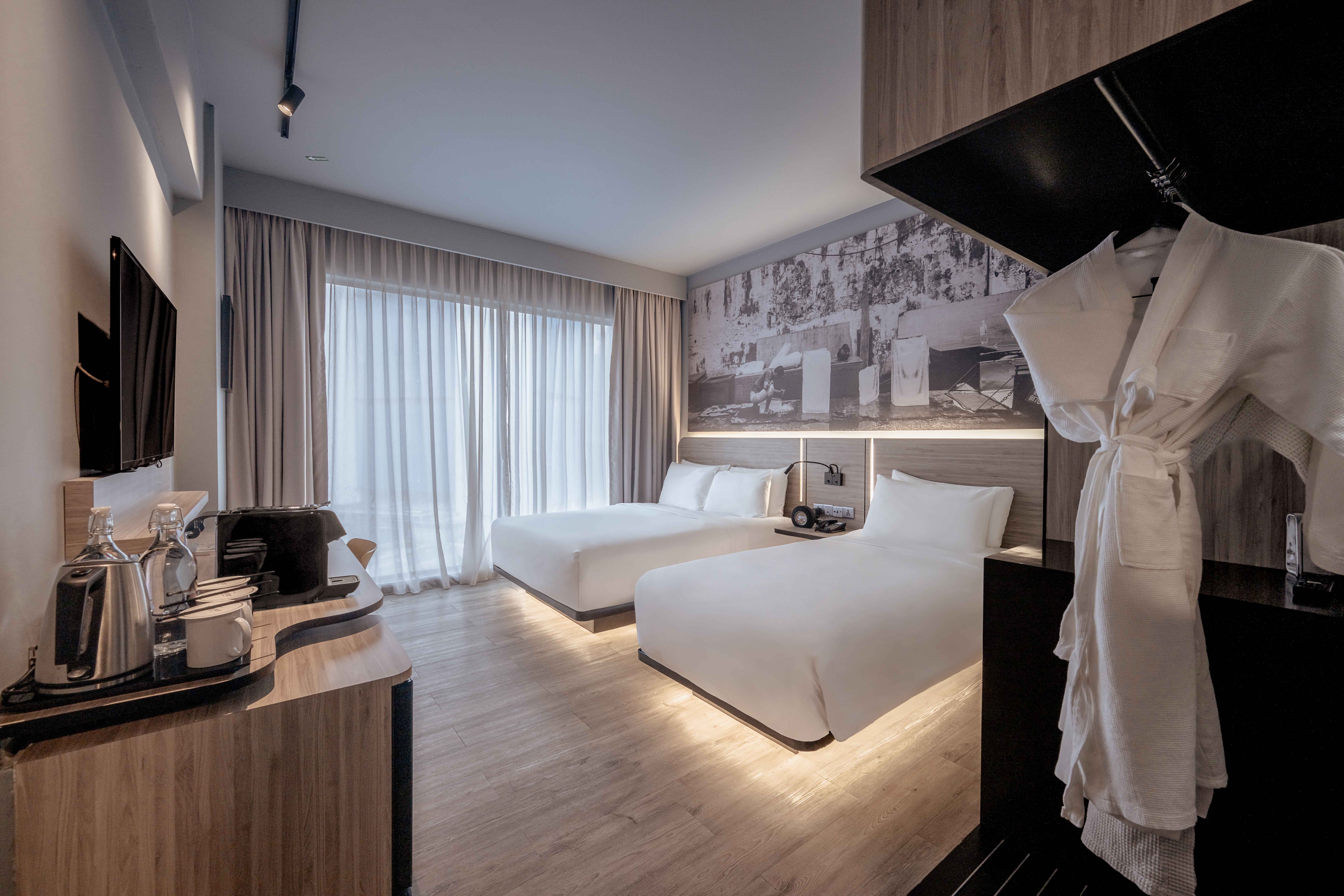 Chic and modern Deluxe Triple room at KL Journal Hotel